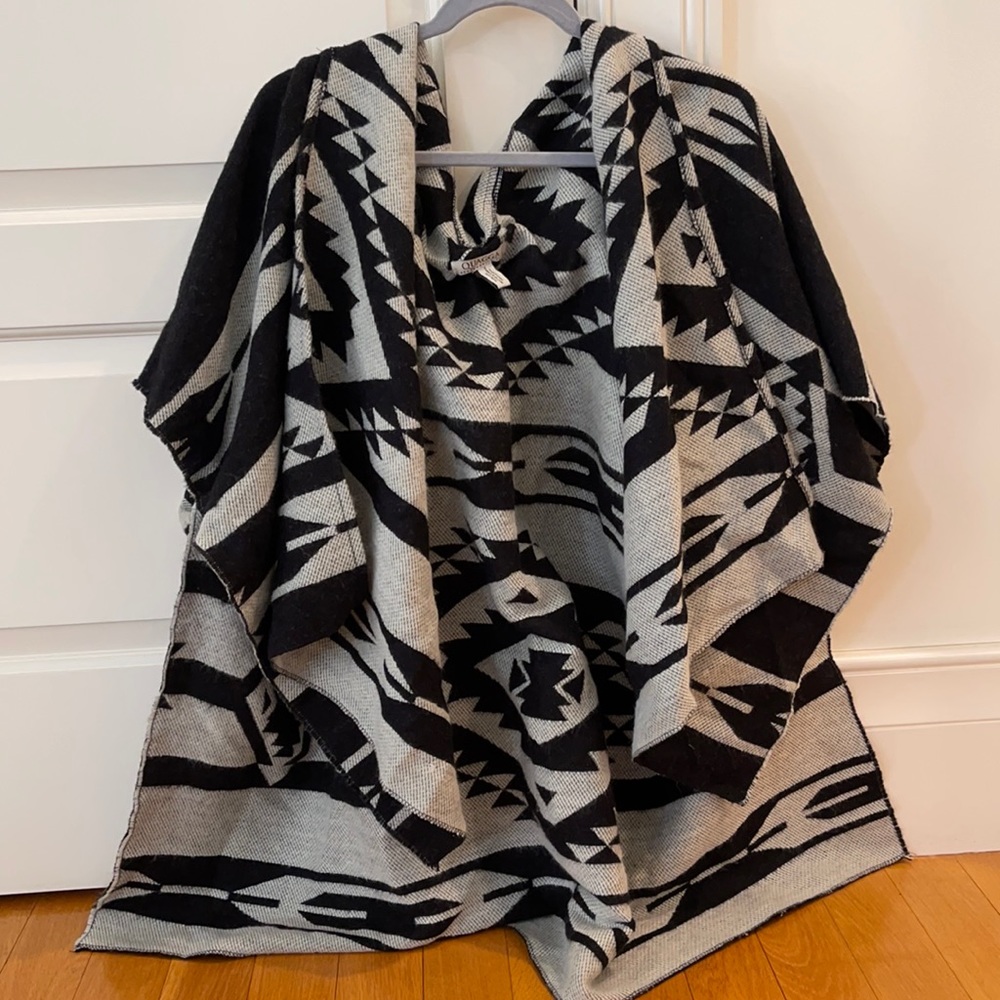 hooded black and white poncho